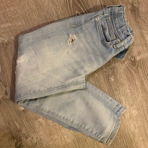 Distressed light wash jeans